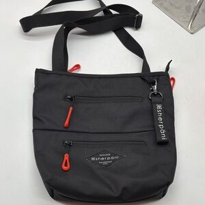 Sherpani Black Crossbody Bag with Red Details